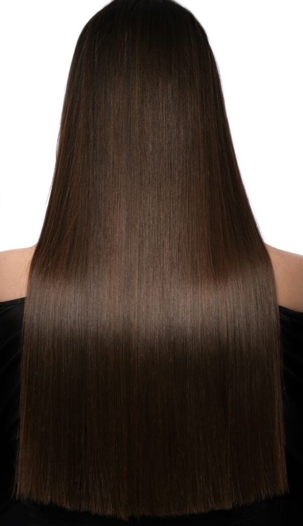 Beautiful brown-haired girl with a perfectly smooth hair. Beauty hair.